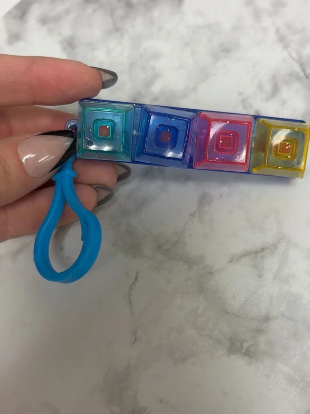 Colorful Mini Keyring Popper Toy - Blue Base with Multicolor Buttons